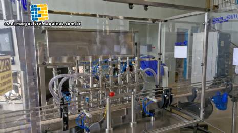 L�nea de llenado completa con m�quinas Tecman Nelpas Tecnoenvase Tudela para el llenado, etiquetado, taponado y posicionamiento de botellas de l�quidos cosm�ticos.