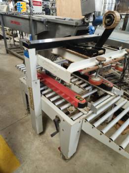 Maquina selladora de cajas de cart�n Strapack