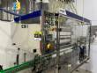 Llenadora gravimtrica y roscadora en sistema lineal de acero inoxidable Robopac IMSB