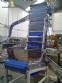 Elevador de posicionamiento y llenado de tapas para la industria de maquinaria SLP