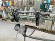 Elevador de posicionamiento y llenado de tapas para la industria de maquinaria SLP